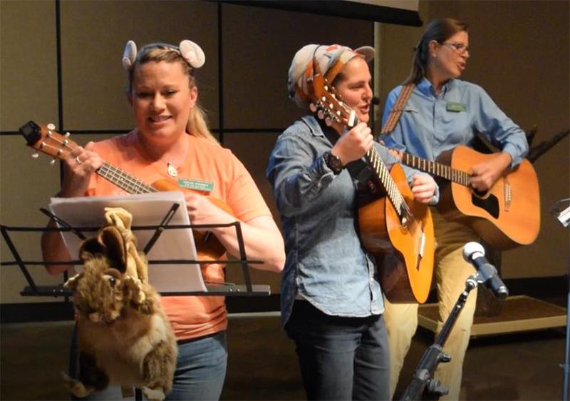 Robin, Michelle, and Catherine playing instruments at a Desert Museum singalong.